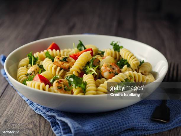 healthy pasta salad with grilled king prawn - pasta salad stock pictures, royalty-free photos & images