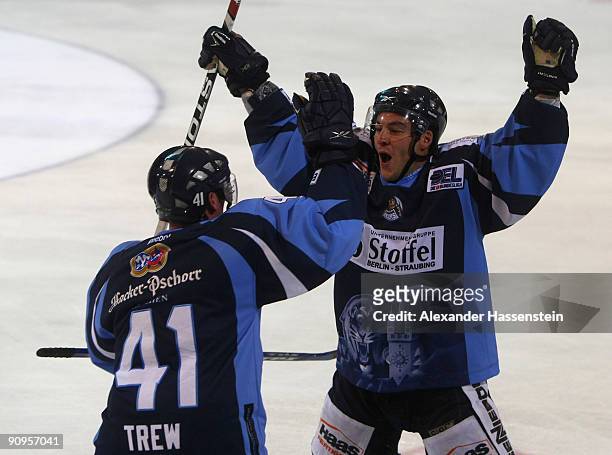 Ryan Ramsay of Straubing celebrates scoring the winning goal with his team mate William Trew after the victory of the the DEL match at the penalty...