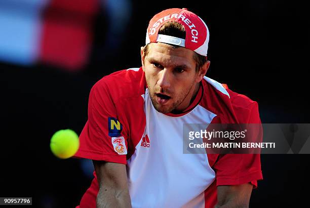 Austria's Jurgen Melzer hits the ball during a match against Chilean Nicolas Massu during their Davis Cup World Group play-off, on September 18, 2009...