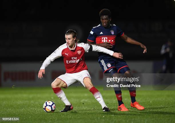 Ben Sheaf of Arsenal is challegned by Kwase Wriedt of Bayern during the Premier League International Cup Match between Arsenal and Bayern Munich at...