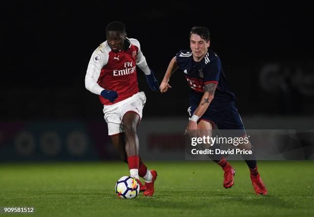 Josh Dasilva of Arsenal is challenged by Adrian Fein of Bayern during the Premier League International Cup Match between Arsenal and Bayern Munich at...