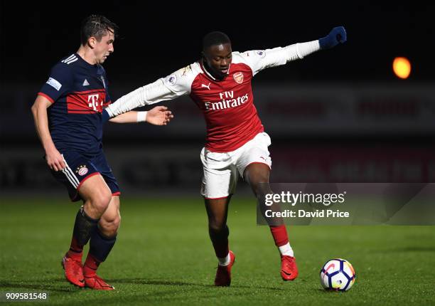 Josh Dasilva of Arsenal is challenged by Adrian Fein of Bayern during the Premier League International Cup Match between Arsenal and Bayern Munich at...