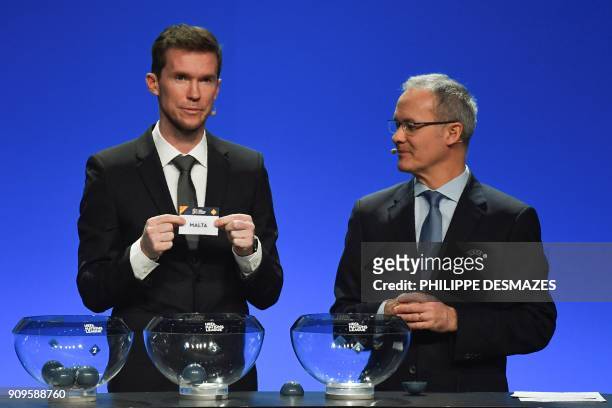 Belarusian football player Alexander Hleb shows the name of Malta next to UEFA director of competitions Giorgio Marchetti during the UEFA Nations...