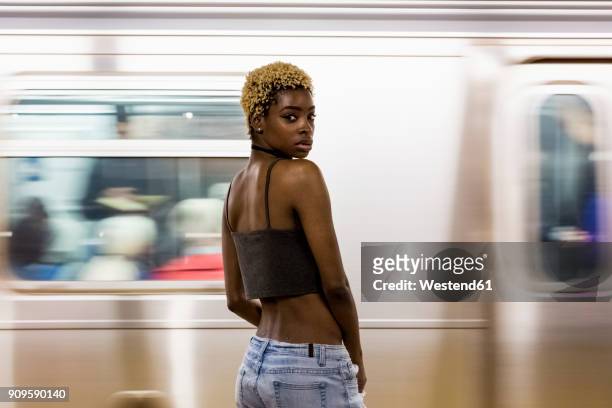 USA, New York City, portrait of woman on subway station platform