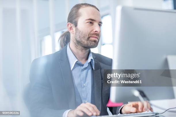 businessman in office working on a computer - person surrounded by computer screens stock pictures, royalty-free photos & images