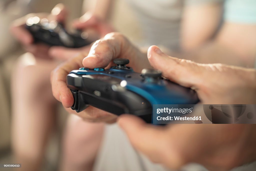 Close-up of hand holding video game controller