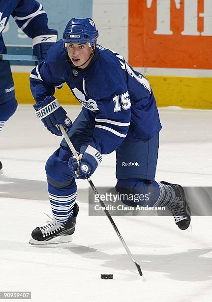 Tomas Kaberle of the Toronto Maple Leafs heads up ice with the puck in a pre-season game against the Philadelphia Flyers on September 17, 2009 at the...