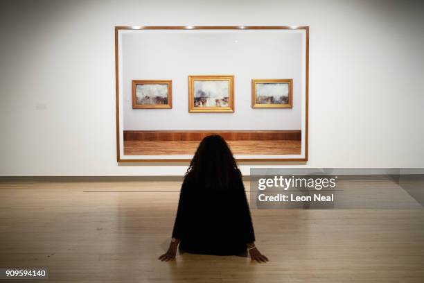 Gallery assistant poses in front of "Turner Collection" by Andreas Gursky in the re-opened Hayward Gallery on January 24, 2018 in London, England....