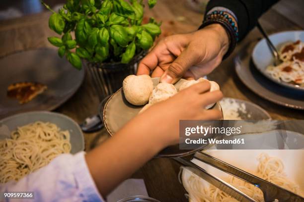 hand serving bread rolls - man offering bread stock pictures, royalty-free photos & images