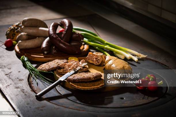 liver sausage, blood sausage, spring onion, red radish, chives, mustard, bread on chopping board, hotplate - black pudding stock pictures, royalty-free photos & images