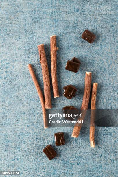 licorice candies and liquorice root - licorice stock pictures, royalty-free photos & images