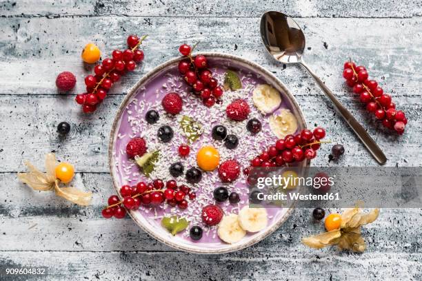 yogurt with fruits, blueberry, red currants, raspberry, kiwi, banane, physalis - banane stock pictures, royalty-free photos & images