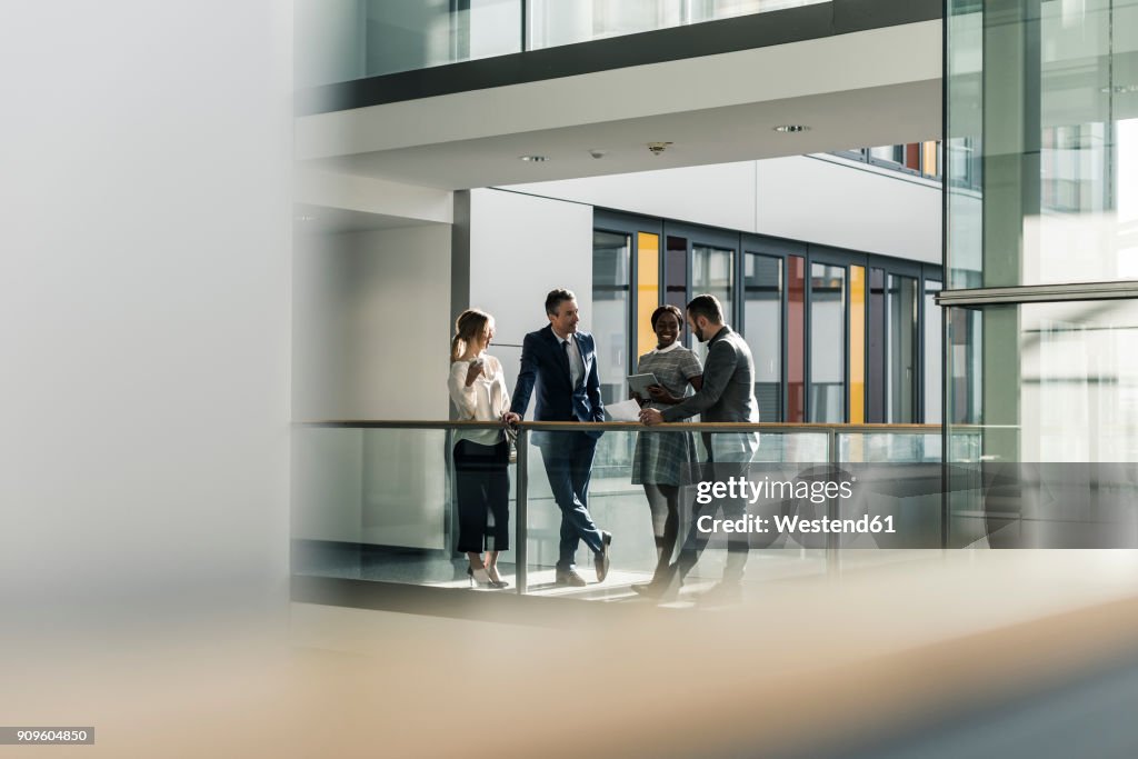 Business people talking on office floor