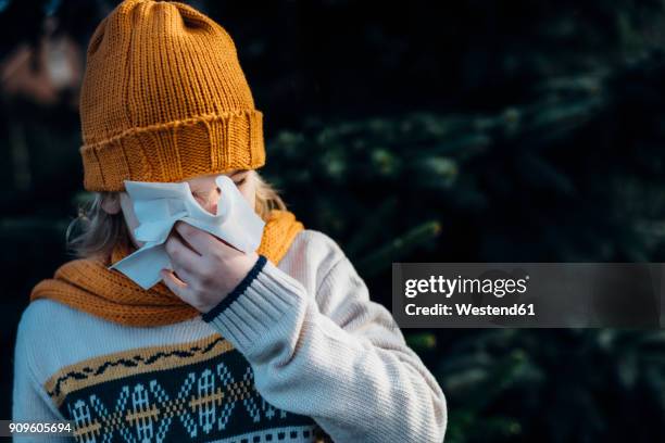 little boy having a cold, blowing his nose - winter illness stock pictures, royalty-free photos & images