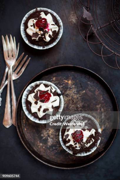 black forest cherry muffins with cream topping and cherry - chocolate chunks top view stock pictures, royalty-free photos & images