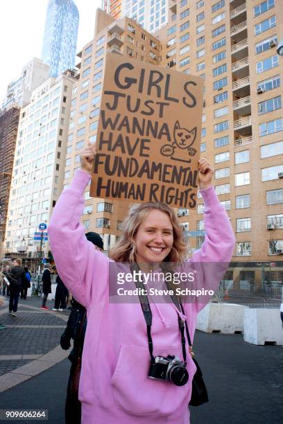 View of an unidentified demonstrator at the Women's March on New York, New York, January 20, 2018. She holds a sign that reads 'Girls Just Wanna Have...