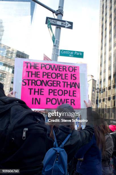 View of an unidentified demonstrator at the Women's March on New York, New York, January 20, 2018. She holds a sign that reads 'The Power Of The...