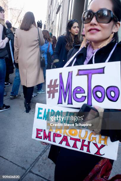 View of an unidentified demonstrator at the Women's March on New York, New York, January 20, 2018. She holds a pair of signs that read '#MeToo' and...