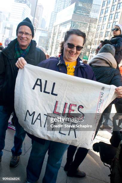 View of an unidentified demonstrator at the Women's March on New York, New York, January 20, 2018. She holds a sign that reads 'All Lies Matter.'