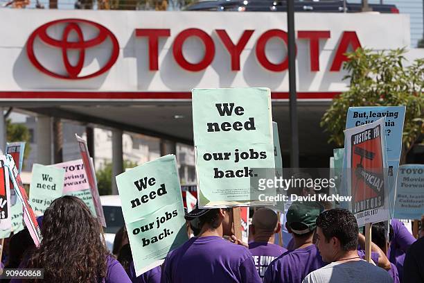 Service Employees International Union member janitors rally to protest the decision to close the only unionized Toyota plant in the U.S. And the...