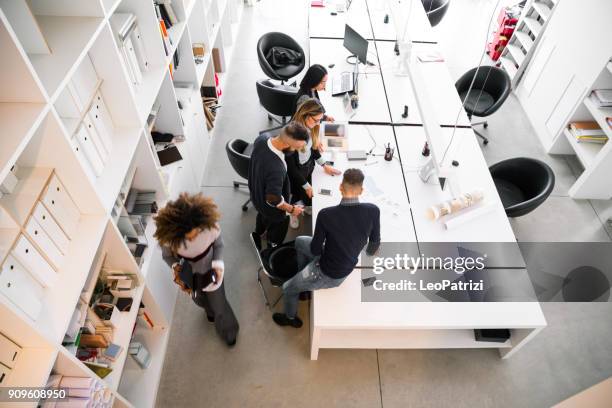 office architect team working on tasks - new and young business - italian designers stock pictures, royalty-free photos & images