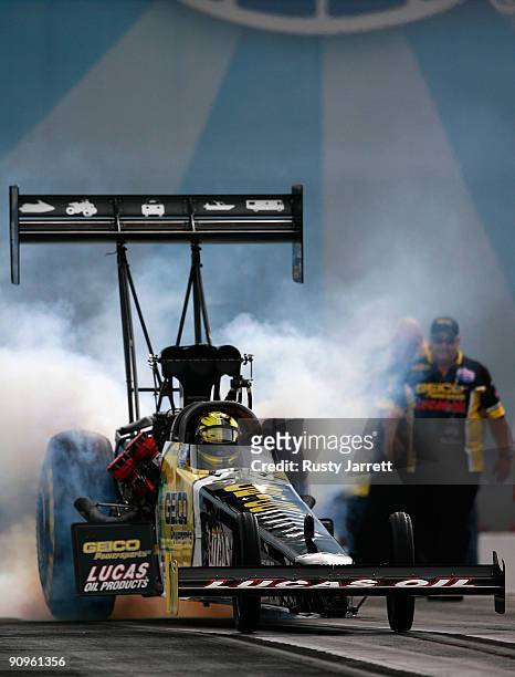 Morgan Lucas, driver of the Geico/Lucas Oil top fuel dragster drives during first round qualifying for the NHRA Carolinas Nationals on September 18,...