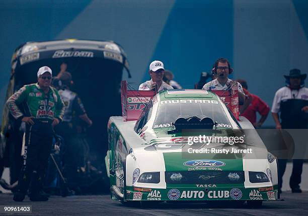 Ashley Force Hood, driver of the Castrol GTX Ford drives during first round qualifying for the NHRA Carolinas Nationals on September 18, 2009 at Zmax...