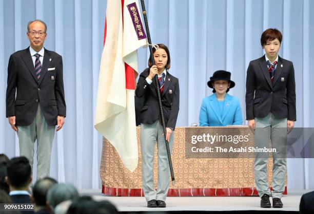 Ski jumper Sara Takanashi receives the national flag during the PyeongChang Winter Olympic Japan Team sending off ceremony at the Ota City General...