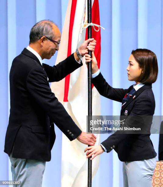 Ski jumper Sara Takanashi receives the national flag during the PyeongChang Winter Olympic Japan Team sending off ceremony at the Ota City General...