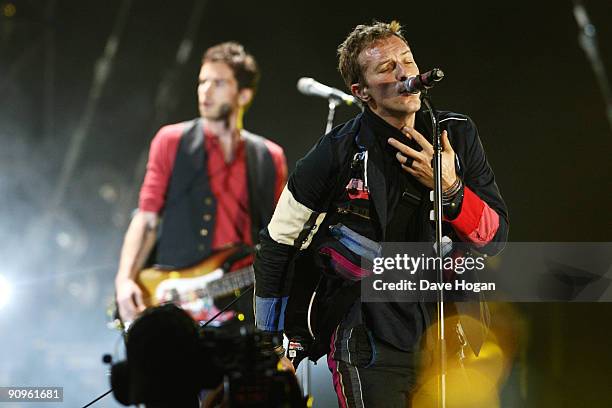 Guy Berryman and Chris Martin of Coldplay perform at Wembley Stadium as part of the 'Viva la Vida' tour on September 18, 2009 in London, England.