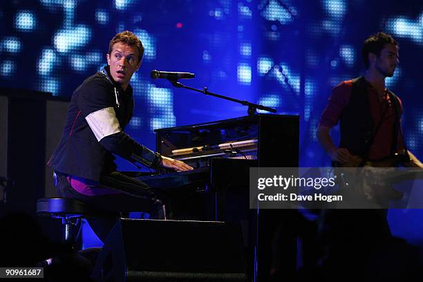 Guy Berryman and Chris Martin of Coldplay performs at Wembley Stadium as part of the 'Viva la Vida' tour on September 18, 2009 in London, England.