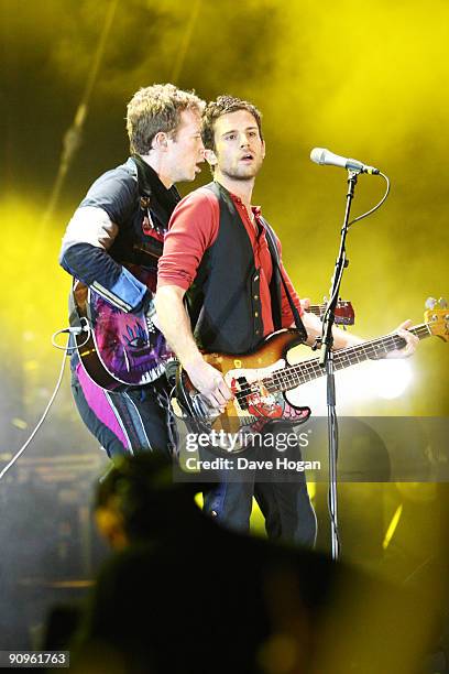 Guy Berryman and Chris Martin of Coldplay perform at Wembley Stadium as part of the 'Viva la Vida' tour on September 18, 2009 in London, England.