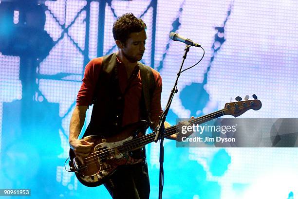 Guy Berryman of Coldplay performs at Wembley Stadium on September 18, 2009 in London, England.
