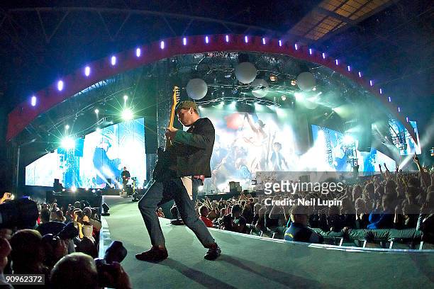 Jonny Buckland of Coldplay performs on stage at Wembley Stadium on September 18, 2009 in London, England.