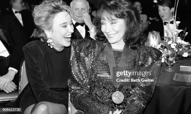 Country singer and songwriter Tanya Tucker and Loretta Lynn attend the Country Music Foundation awards on February 18, 1994 in Nashville, Tennessee.
