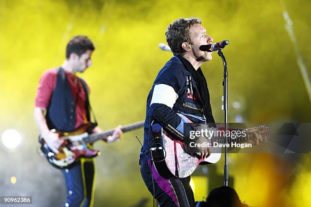 Guy Berryman and Chris Martin of Coldplay perform at Wembley Stadium as part of the 'Viva la Vida' tour on September 18, 2009 in London, England.