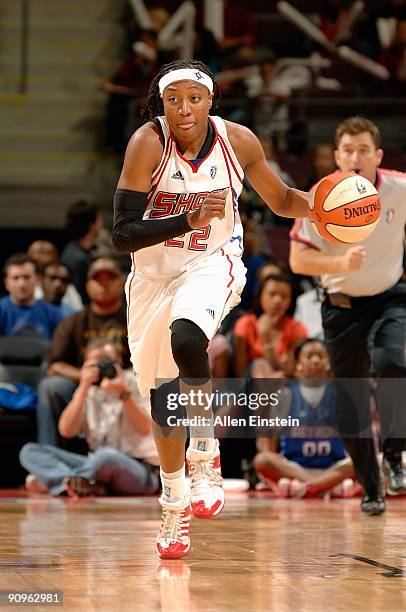 Alexis Hornbuckle of the Detroit Shock drives the ball up court in Game one of the Eastern Conference Semifinals against the Atlanta Dream during the...