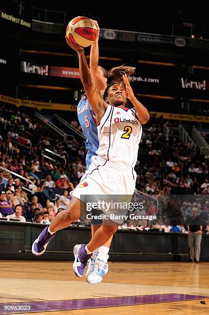 Temeka Johnson of the Phoenix Mercury lays the ball up against Shalee Lehning of the Atlanta Dream during the WNBA game on September 5, 2009 at US...