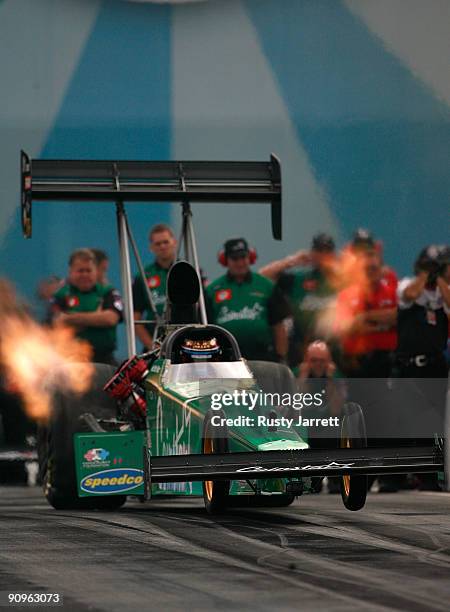 Hot Rod Fuller, driver of the Coinstar top fuel dragster drives during first round qualifying for the NHRA Carolinas Nationals on September 18, 2009...