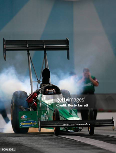 Hot Rod Fuller, driver of the Coinstar top fuel dragster drives during first round qualifying for the NHRA Carolinas Nationals on September 18, 2009...