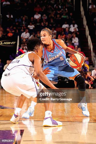 Shalee Lehning of the Atlanta Dream goes up against Cappie Pondexter of the Phoenix Mercury during the WNBA game on September 5, 2009 at US Airways...