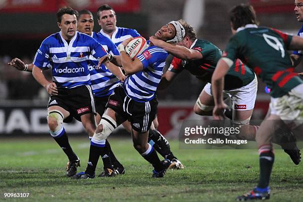Gio Aplon tackled during the Absa Currie Cup match between Platinum Leopards and Western Province from Coca-Cola Park on September 18, 2009 in...