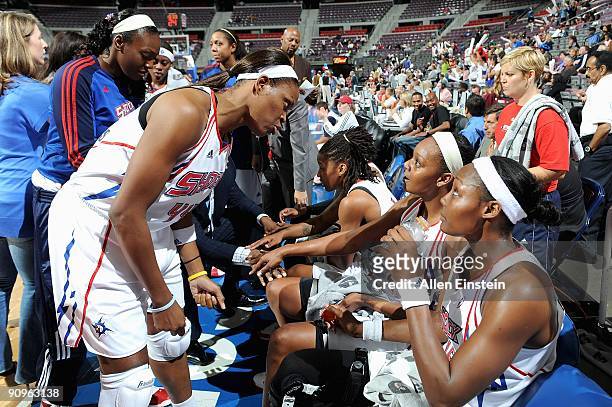 Taj McWilliams talks to Olayinka Sanni and Cheryl Ford of the Detroit Shock during the game against the Atlanta Dream in Game one of the Eastern...