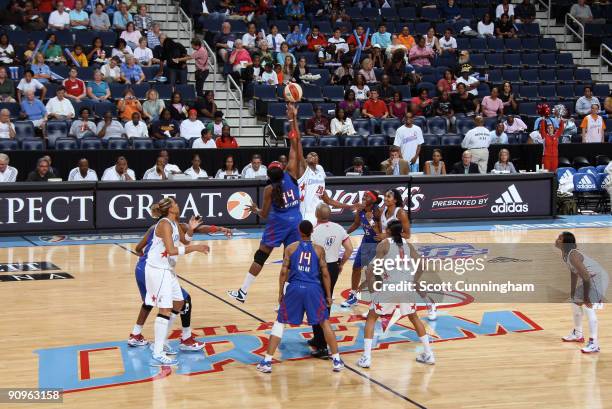 Sancho Lyttle of the Atlanta Dream jumps against Taj McWilliams-Franklin of the Detroit Shock to start Game Two of the WNBA Eastern Conference...