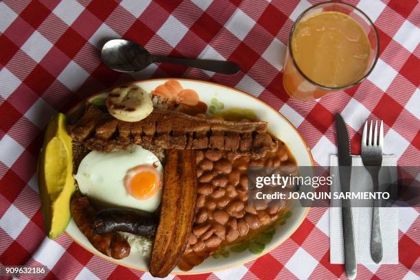 This picture shows a "Bandeja Paisa" at a restaurant in Medellin, Antioquia department, on January 22, 2018. - The "Bandeja Paisa" is a traditional...