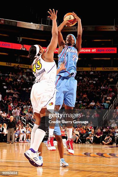 Michelle Snow of the Atlanta Dream goes up for a shot over Le'coe Willingham of the Phoenix Mercury during the WNBA game on September 5, 2009 at US...