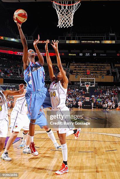 Michelle Snow of the Atlanta Dream lays the ball up over DeWanna Bonner of the Phoenix Mercury during the WNBA game on September 5, 2009 at US...