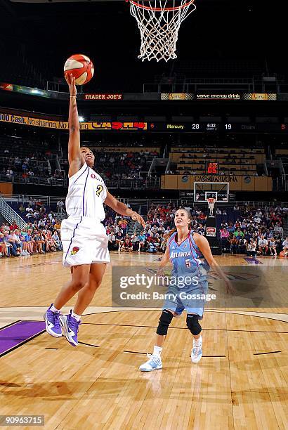 Temeka Johnson of the Phoenix Mercury lays the ball up over Shalee Lehning of the Atlanta Dream during the WNBA game on September 5, 2009 at US...