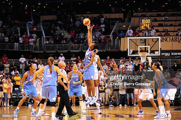 Michelle Snow of the Atlanta Dream tips off against Tangela Smith of the Phoenix Mercury during the WNBA game on September 5, 2009 at US Airways...