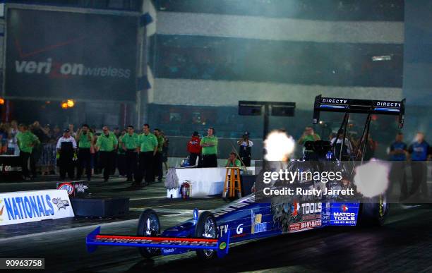 Antron Brown, driver of the Matco Tools top fuel dragster drives during second round qualifying for the NHRA Carolinas Nationals on September 18,...